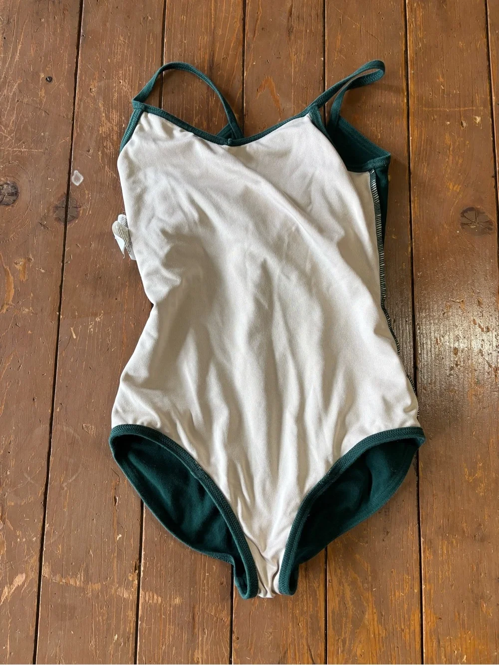 Capezio forest green camisole leotard with a v-neckline and princess seams.